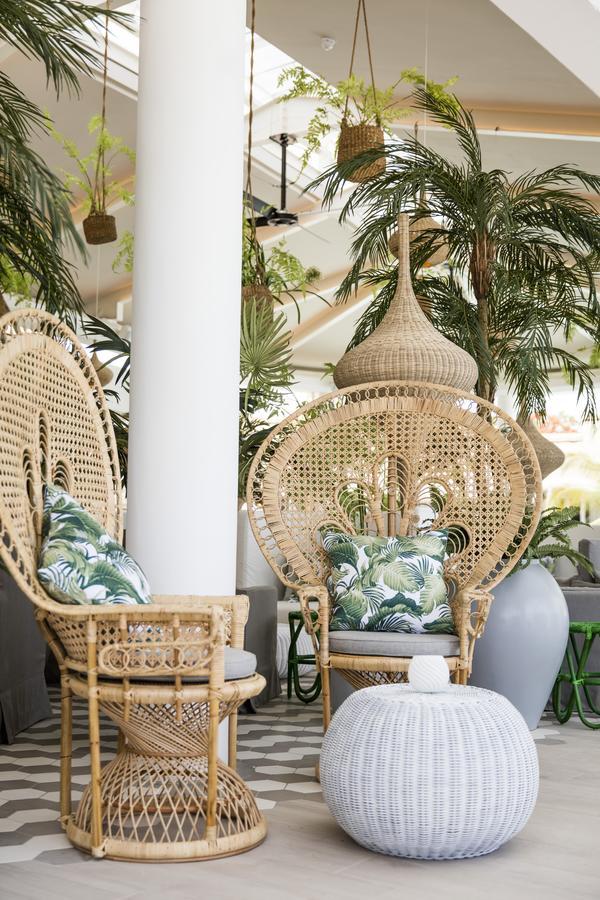 Lux* Grand Gaube Resort & Villas Exterior photo A pair of peacock chairs